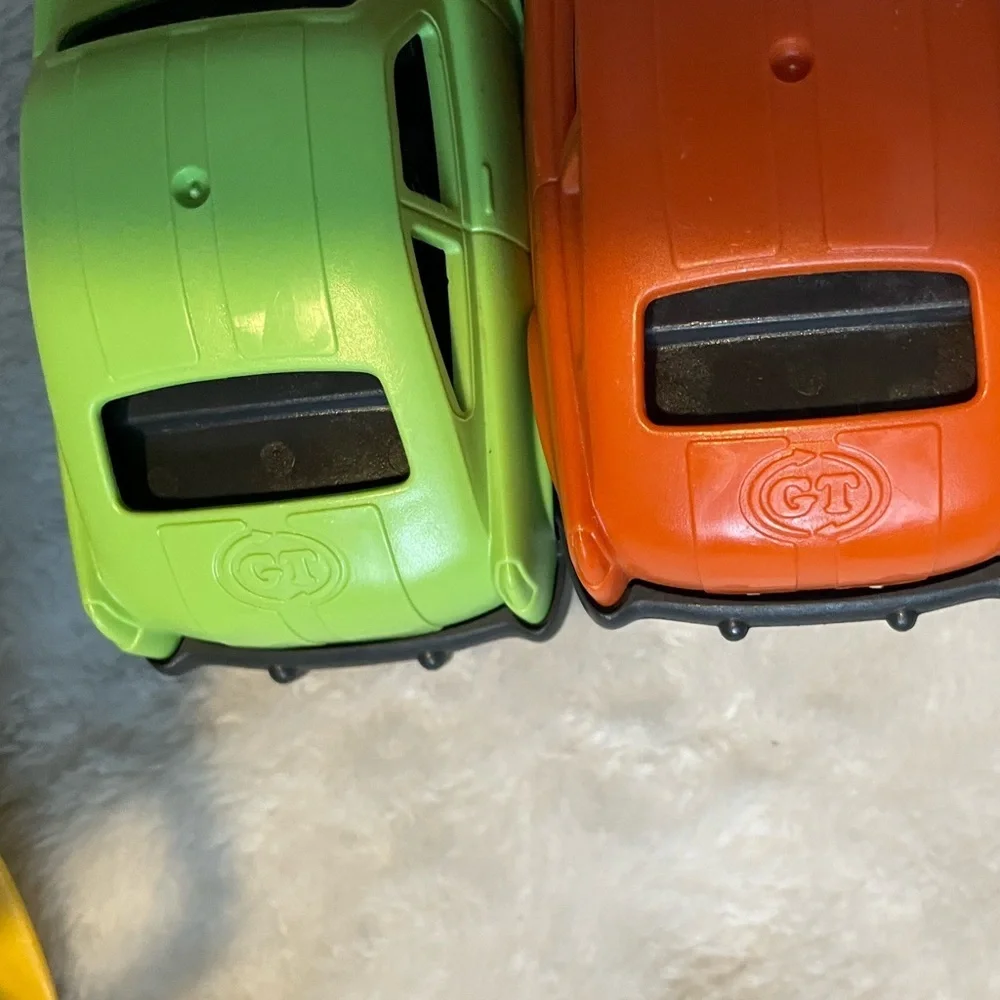 Bundle of Green Toys Firetruck, Car Loader, and Cement Truck